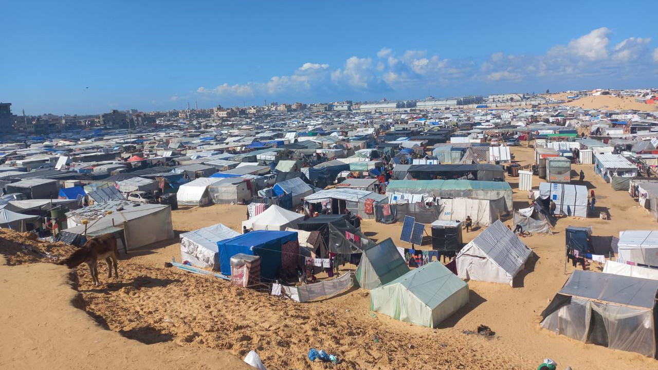 Displaced Palestinians shelter in a tent encampment in Rafah, in southern Gaza, along the border with Egypt, in February 2024 (Tarneem Hammad)